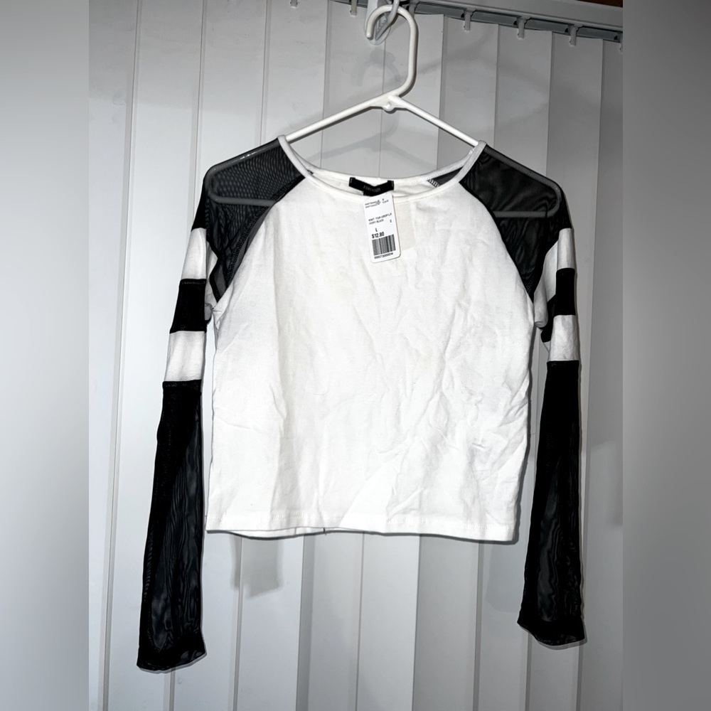 FOREVER TWENTYONE white shirt with Black sleeves.